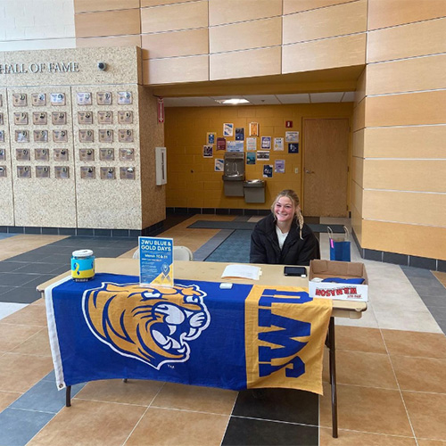 SAAC member Jordan Restivo '22 sets up a table to fundraise for Ukraine