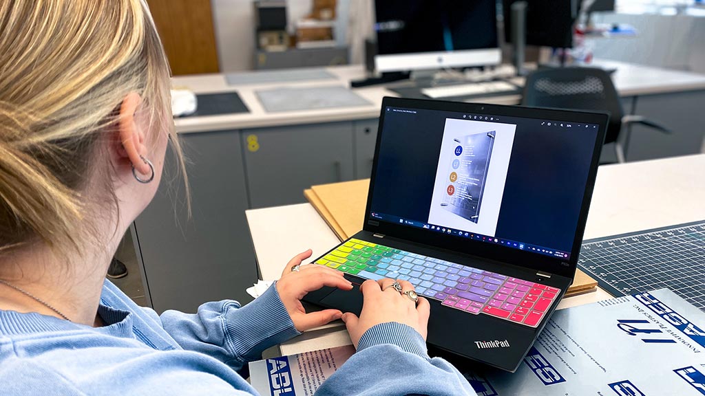 female college student using laptop