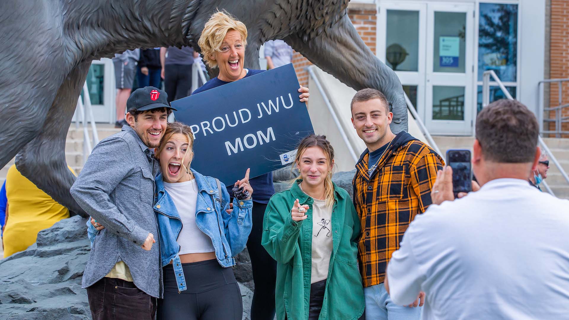 A family posing in front of the Wildcat statue