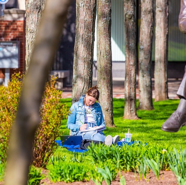Student in Gaebe Commons in Spring