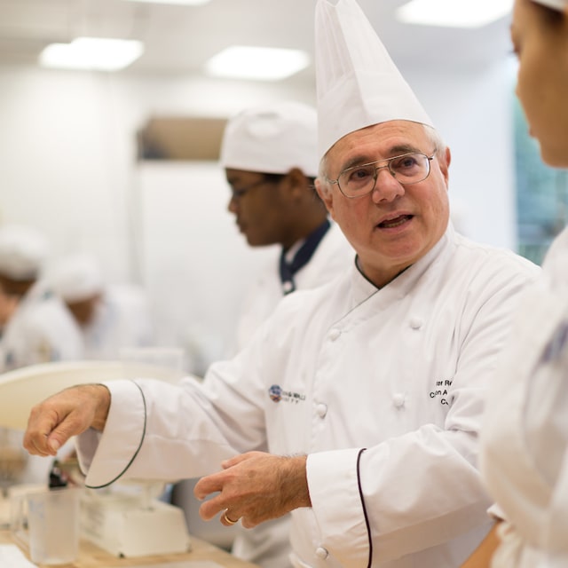 Charlotte faculty member Peter Reinhart teaching an artisan bread class.