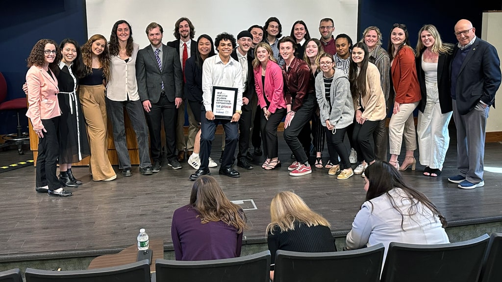 JWU Providence ADTEAM with the plaque announcing their regional win.