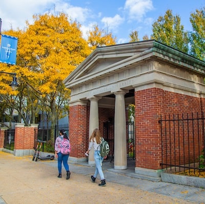 Two students walk by Gaebe Commons