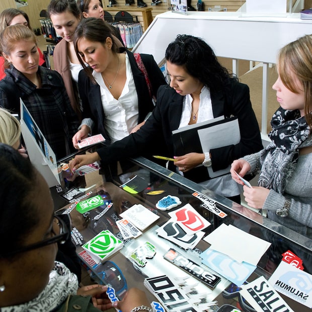 Fashion Merchandising students assessing a retail store display.