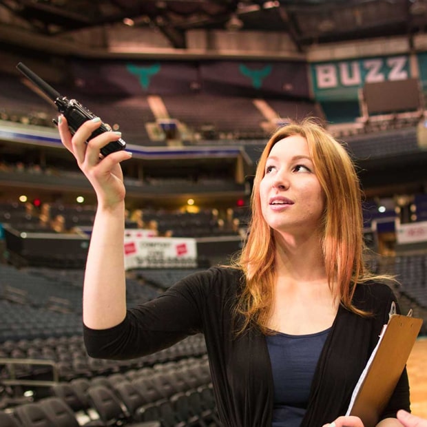 JWU student working at a sports arena.