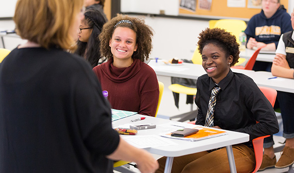 JWU students smiling in class