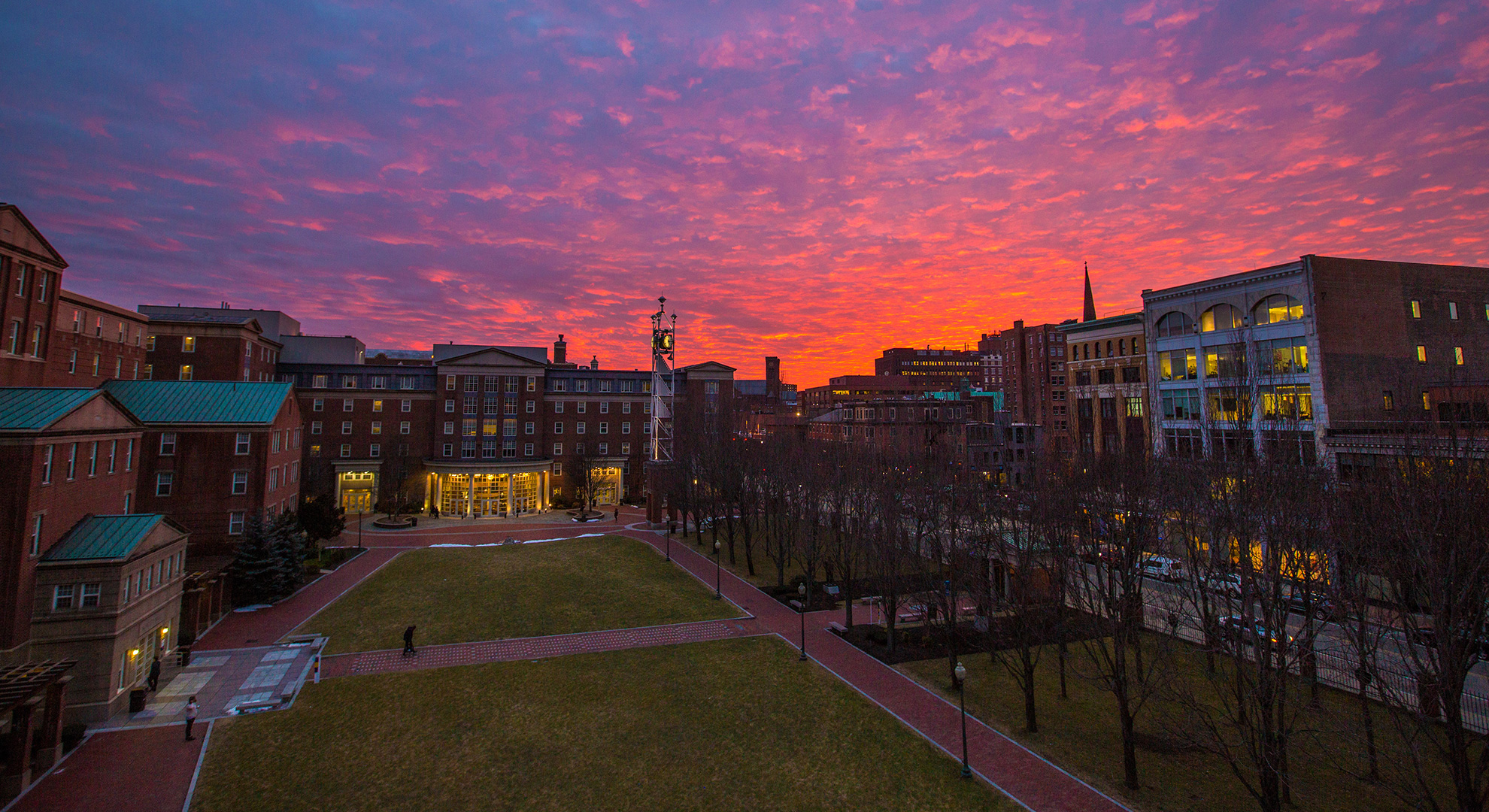 Aerial shot of Gaebe commons with a beautiful sunset in the background - purple pink and orange colors