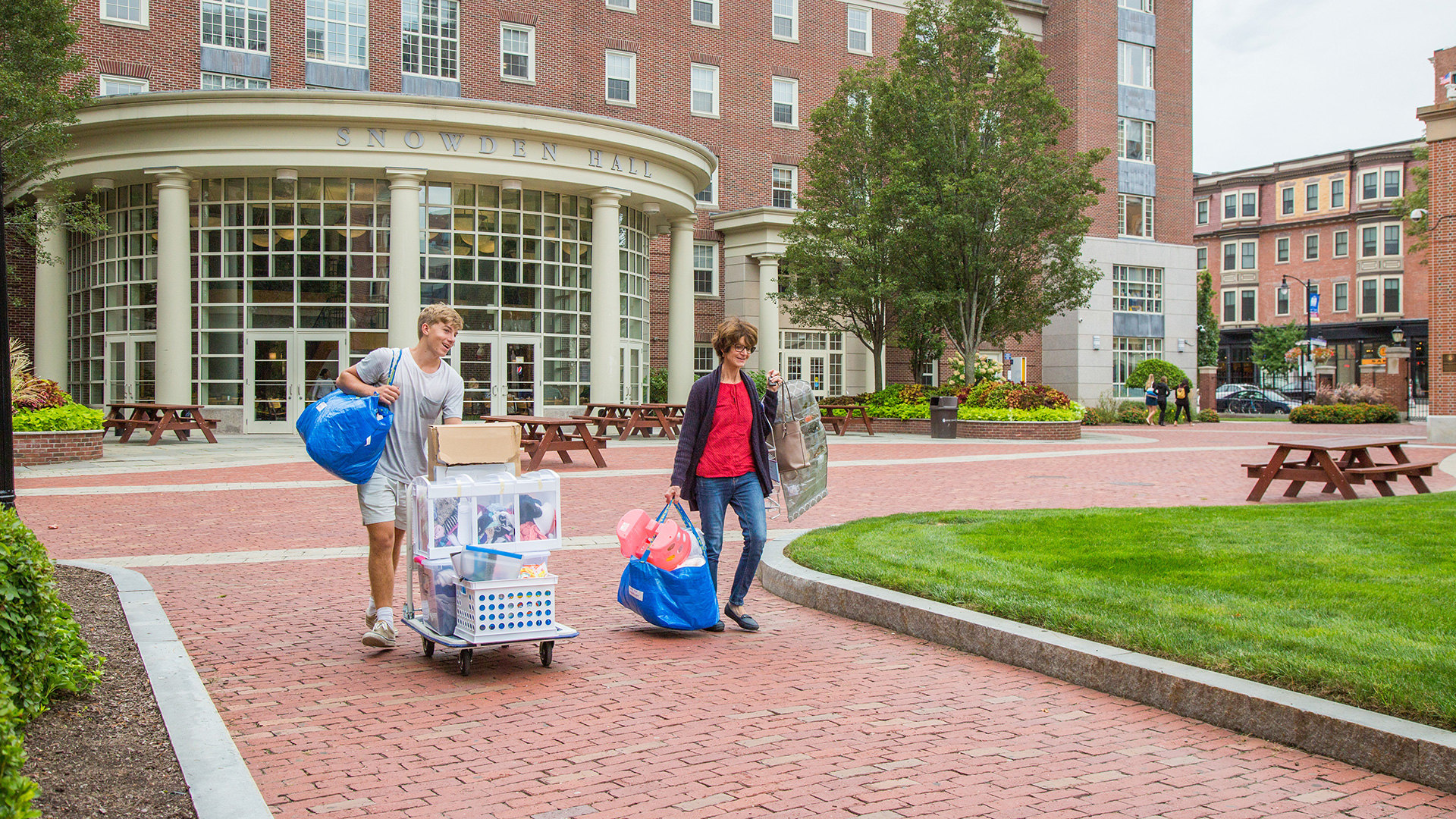 Mother helping her son move onto campus on move-in day