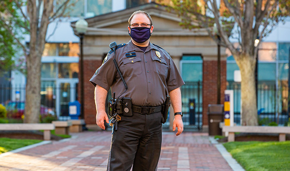 Safety & Security officer headshot - in front of Gaebe commons wearing a mask