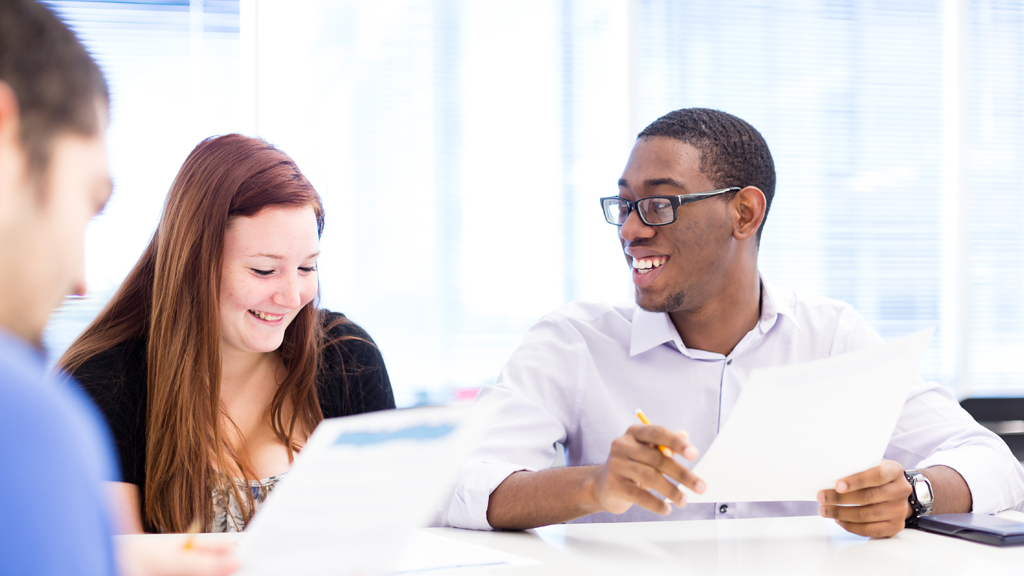 Students talking in a classroom