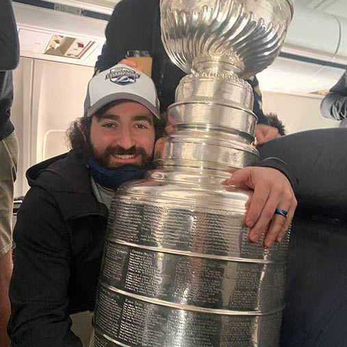 JWU alumni Jason Berger '07 poses with the Stanley Cup
