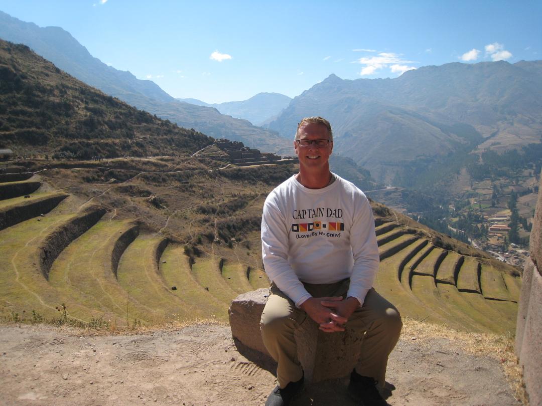 James Casey sitting on mountainside