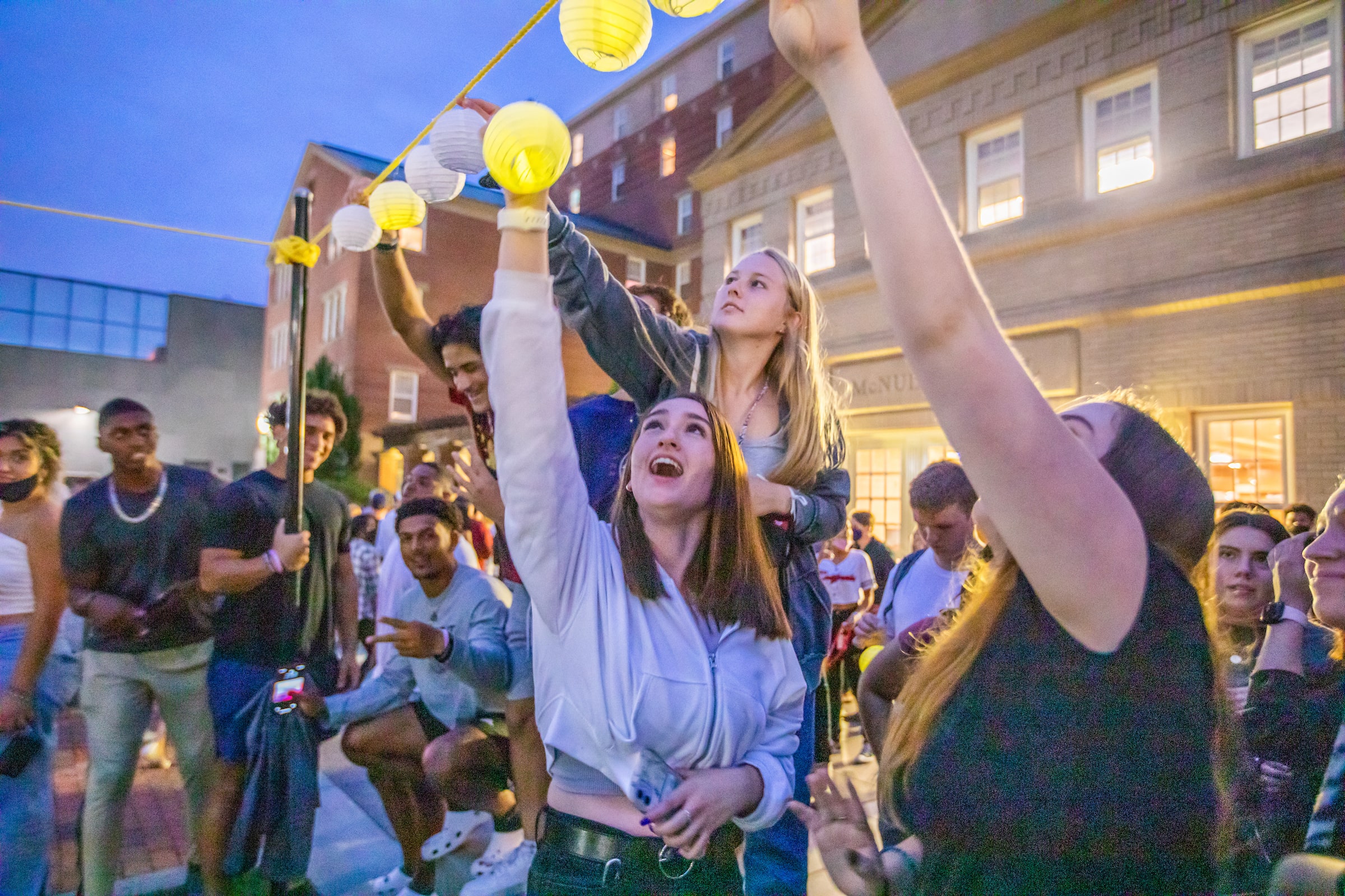 Students hang lanterns at Ignite the Night