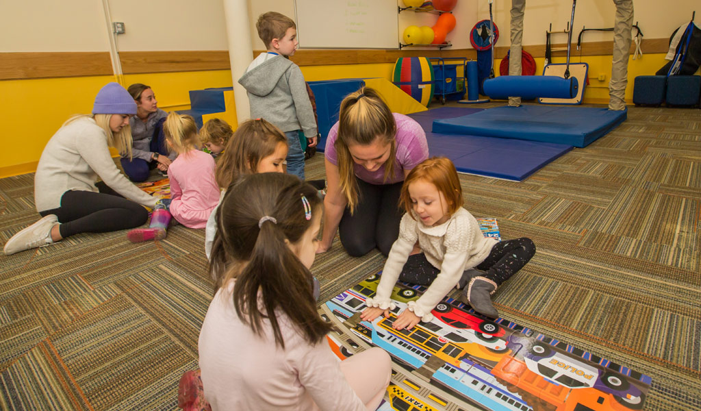 OTD students working with kids in the lab