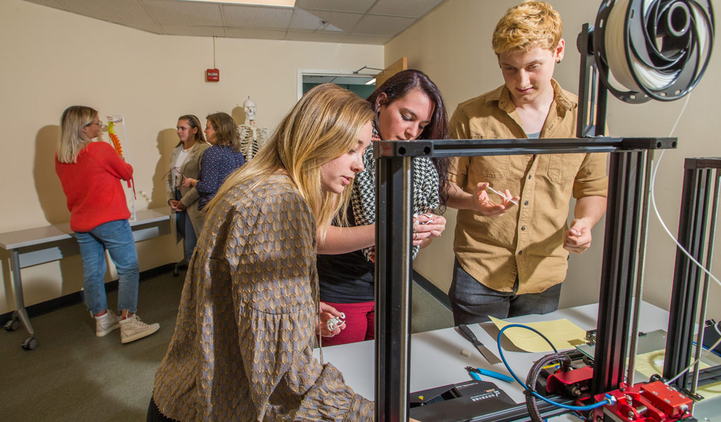 Three OTD students in the lab