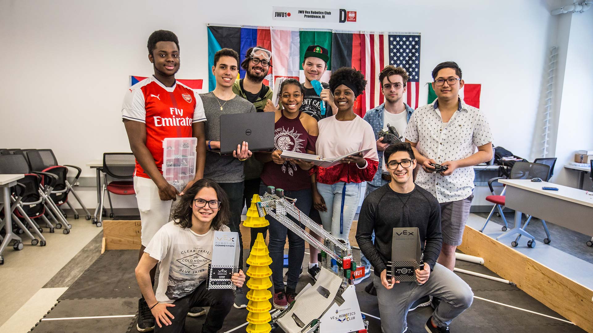 Members of the robotics team hold trophy
