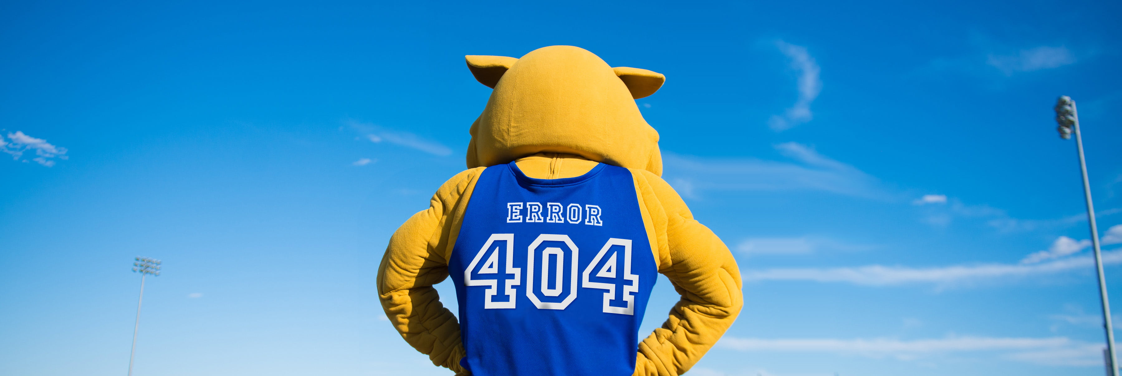 A photo of Wildcat Willy wearing a jersey with the number 404 on it