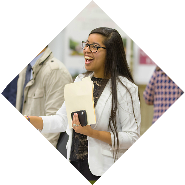 Smiling student holding folder