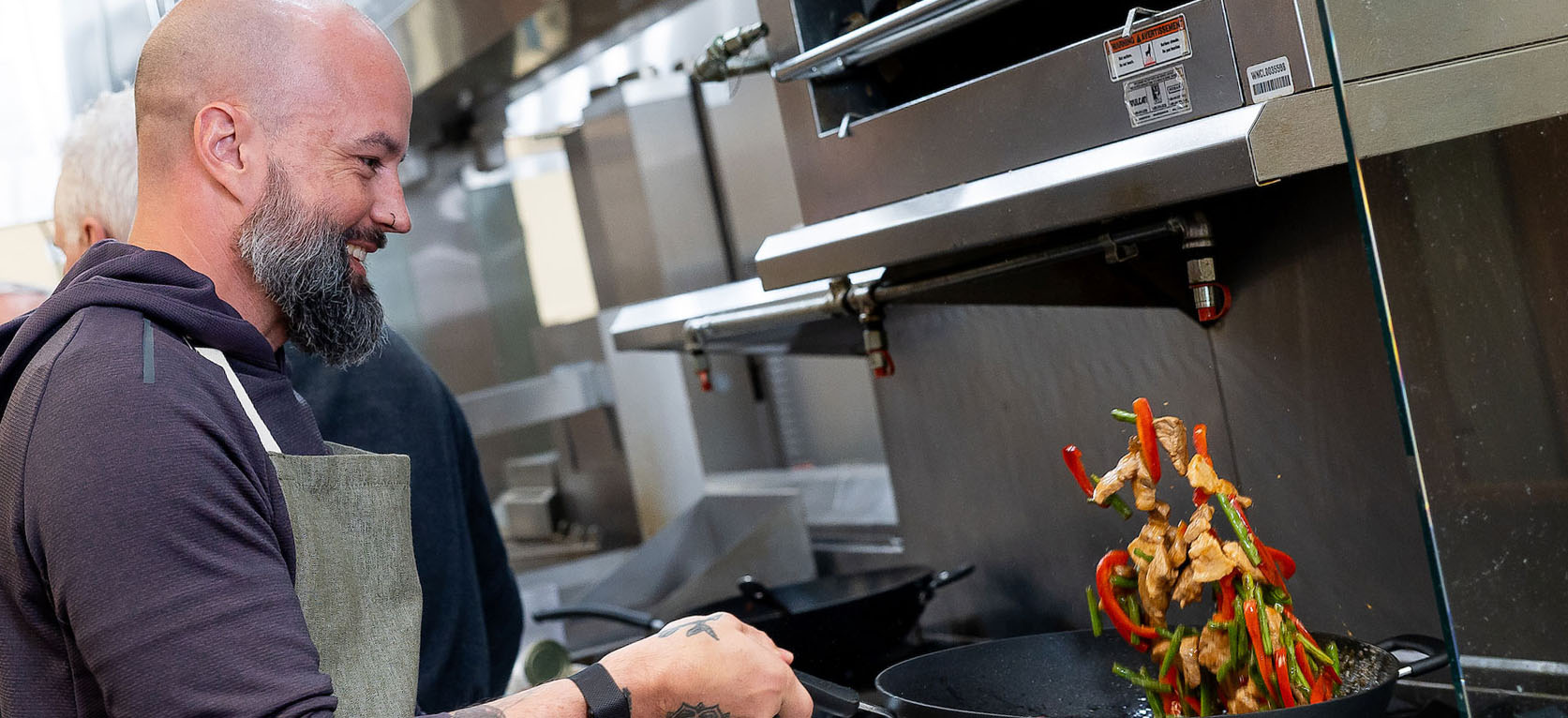 Wok cooking during a cooking class at JWU Charlotte.