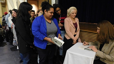 Jeannette Walls autographing books for JWU students.