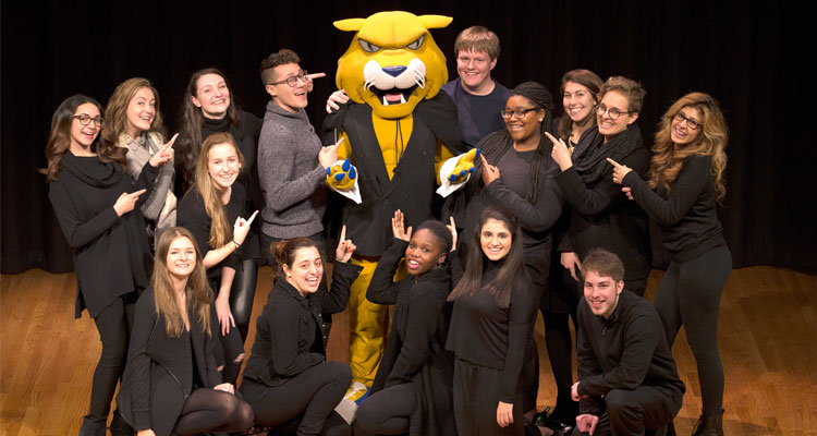 The JWU Wonderland Chorus with Wildcat Willie.