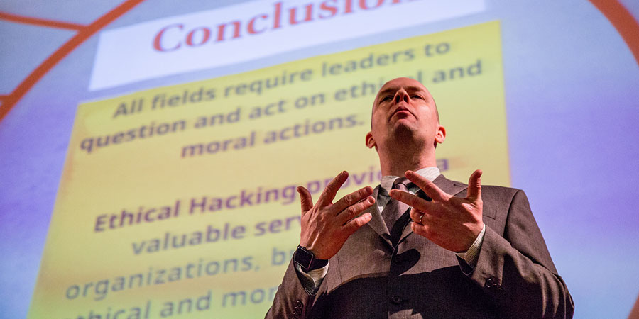 Joshua Wright '97 speaking at JWU’s Providence Campus.