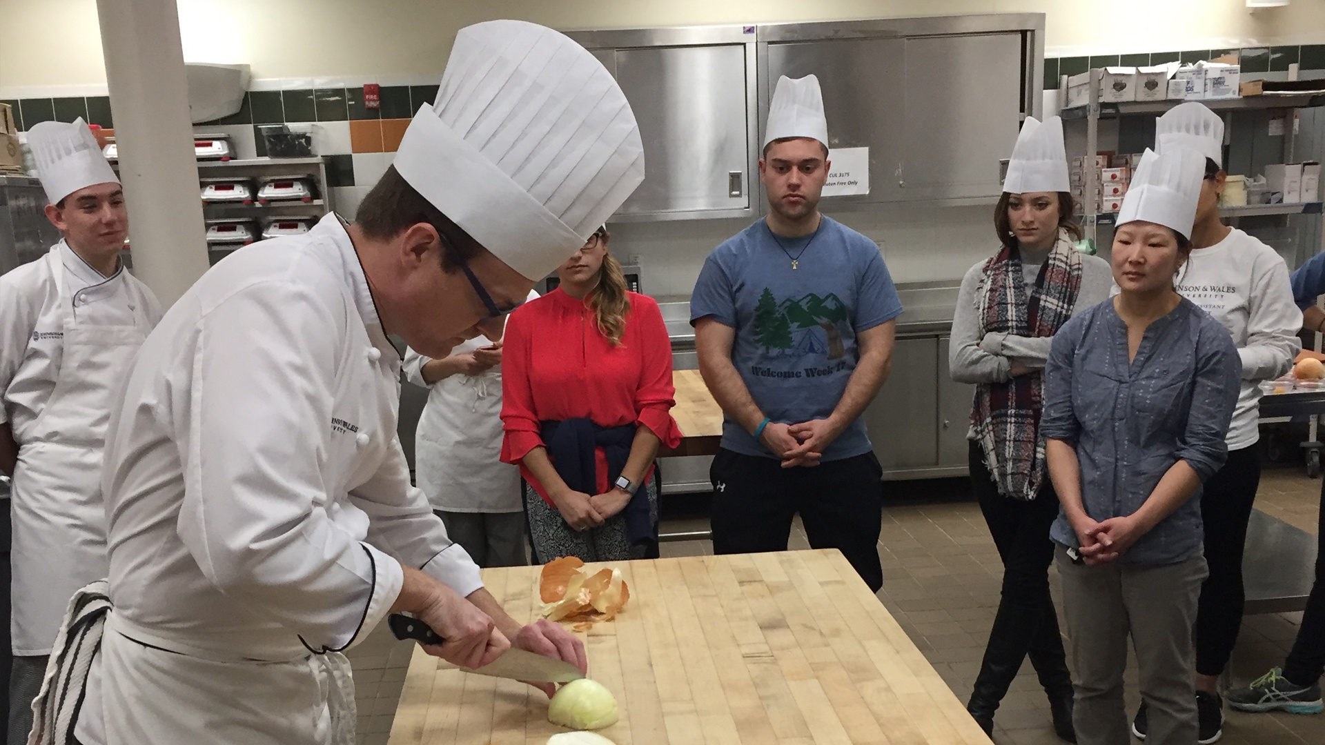 Todd Seyfarth demonstrates knife skills at the beginning of class.