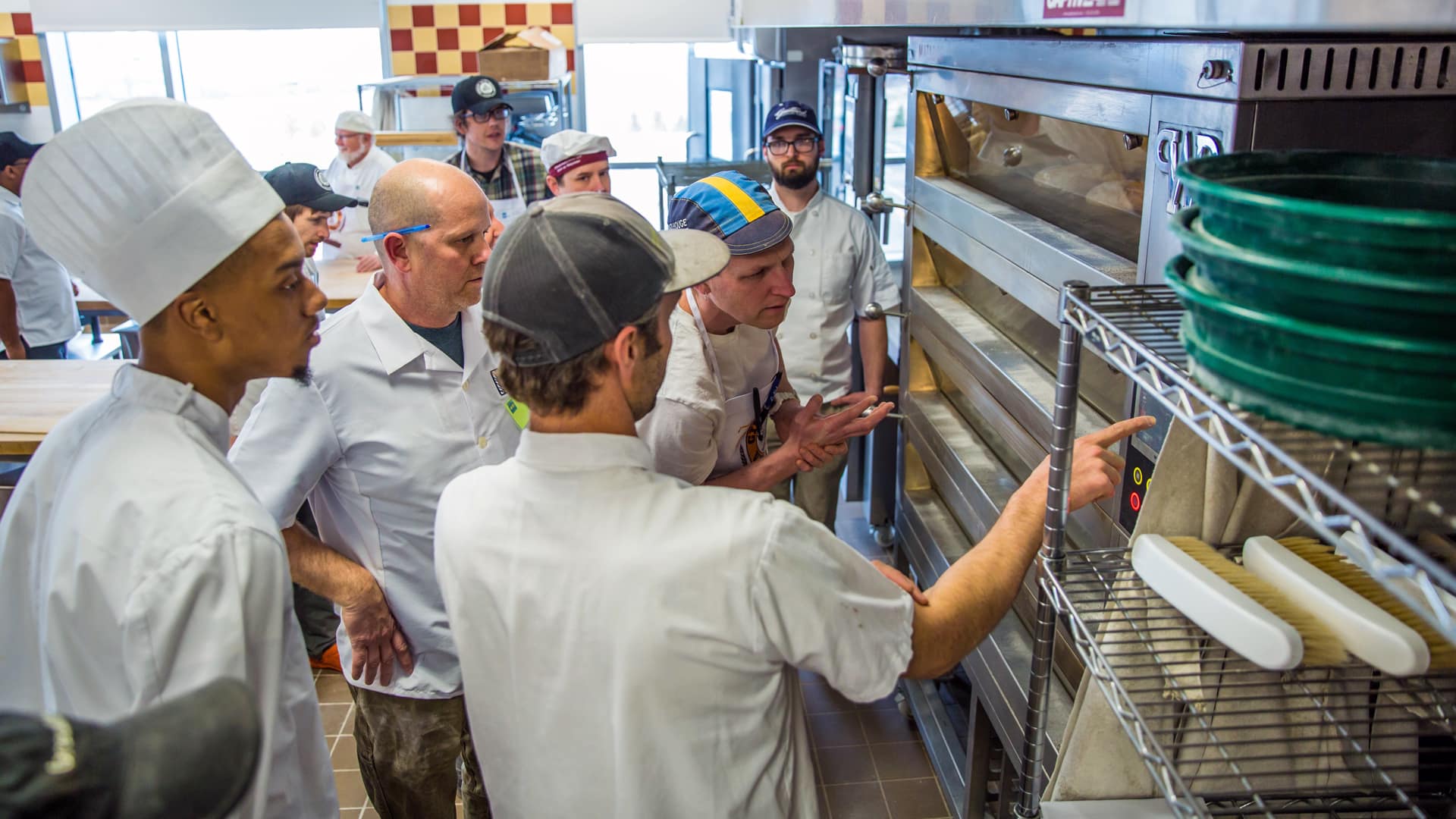 Students gathered around Jim Williams of Seven Stars Bakery to see him in action.