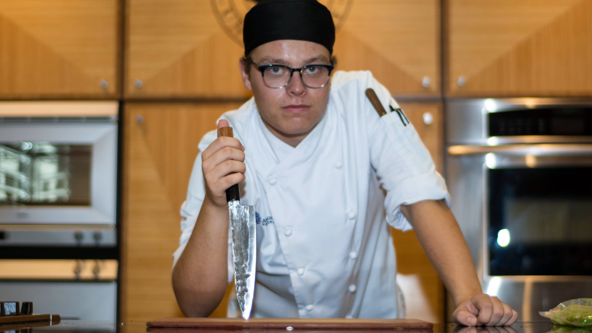 Noah Rosen '19 posing with a Forge to Table chef’s knife.