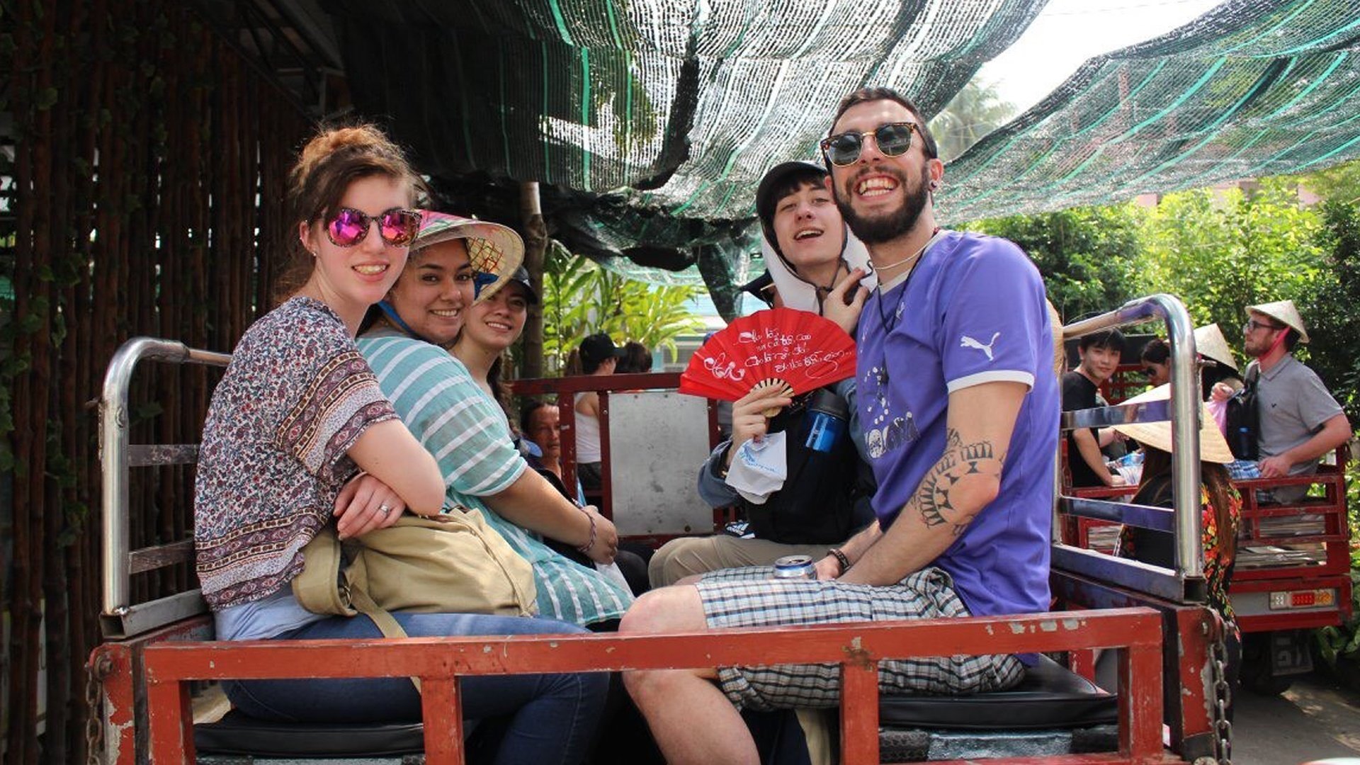 Julia (left) and students Cesia, Maria, Aren and Kyle experience a tuk-tuk ride in the islands of the Mekong Delta in Vietnam. 
