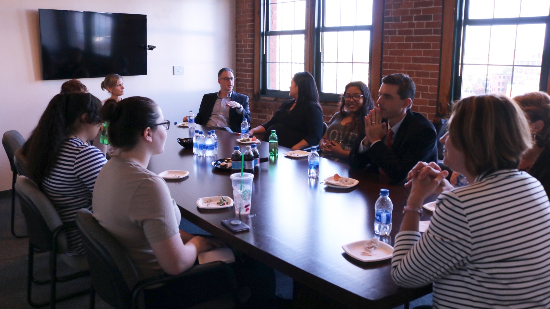 Grace Tulsan speaking with JWU faculty and students.