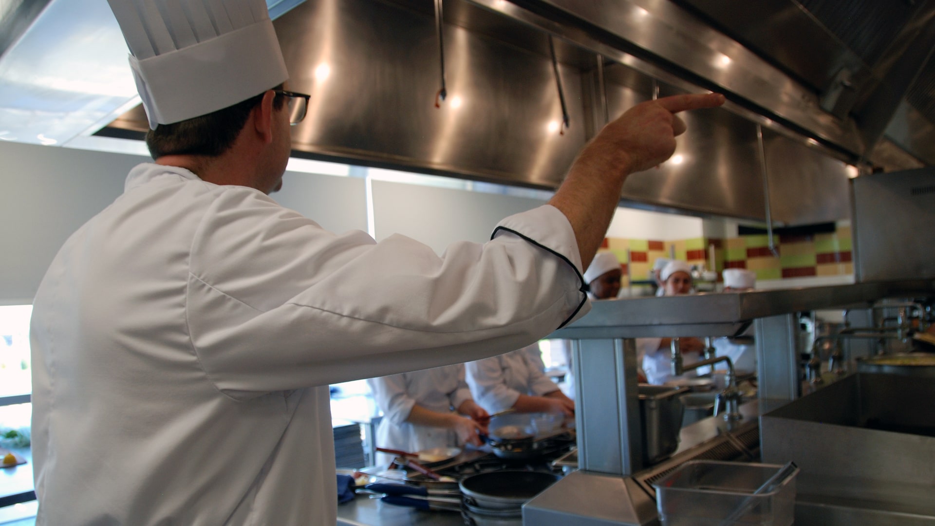 Chef Matthew Britt in the kitchen with students