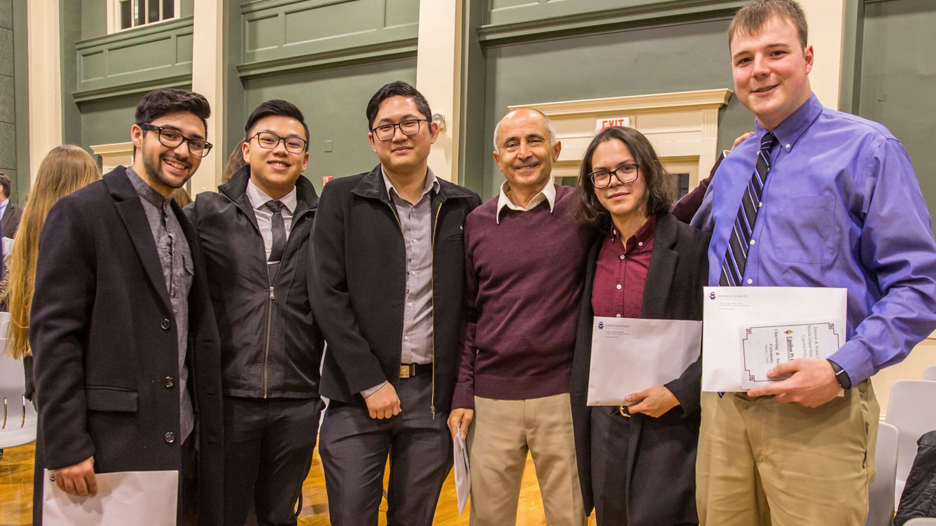 Students pose for a photo with Professor Neeman after the ceremony.