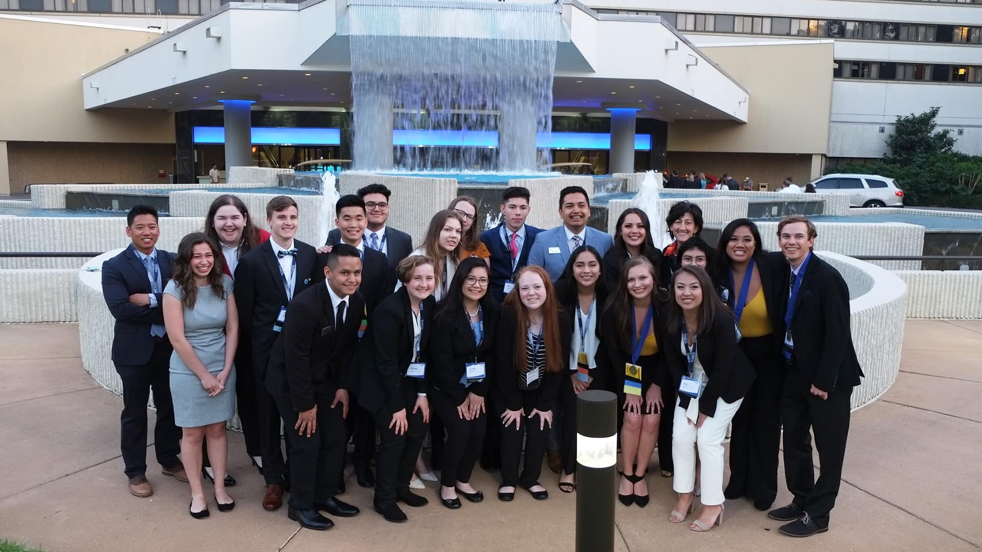 larger DECA groun in front of fountain