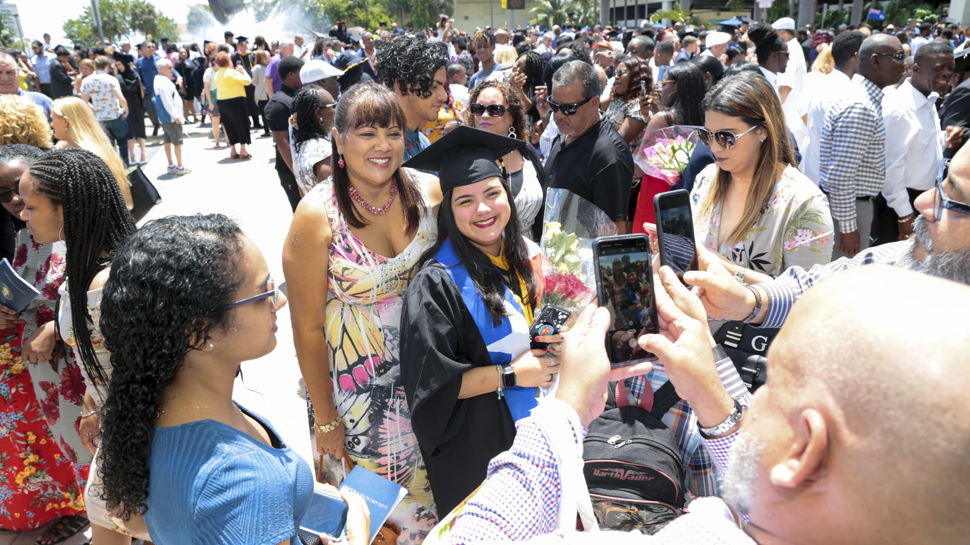 Taking pictures at commencement.