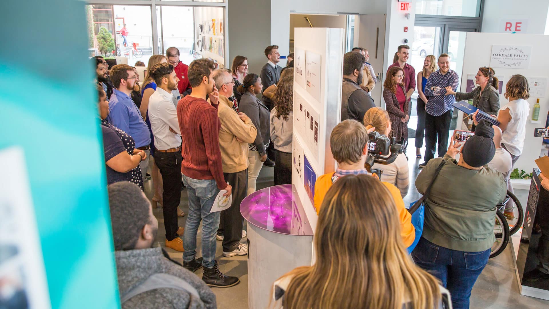 Professors Deana Marzocchi and Karyn Jimenez-Elliott hand out awards during the exhibit.