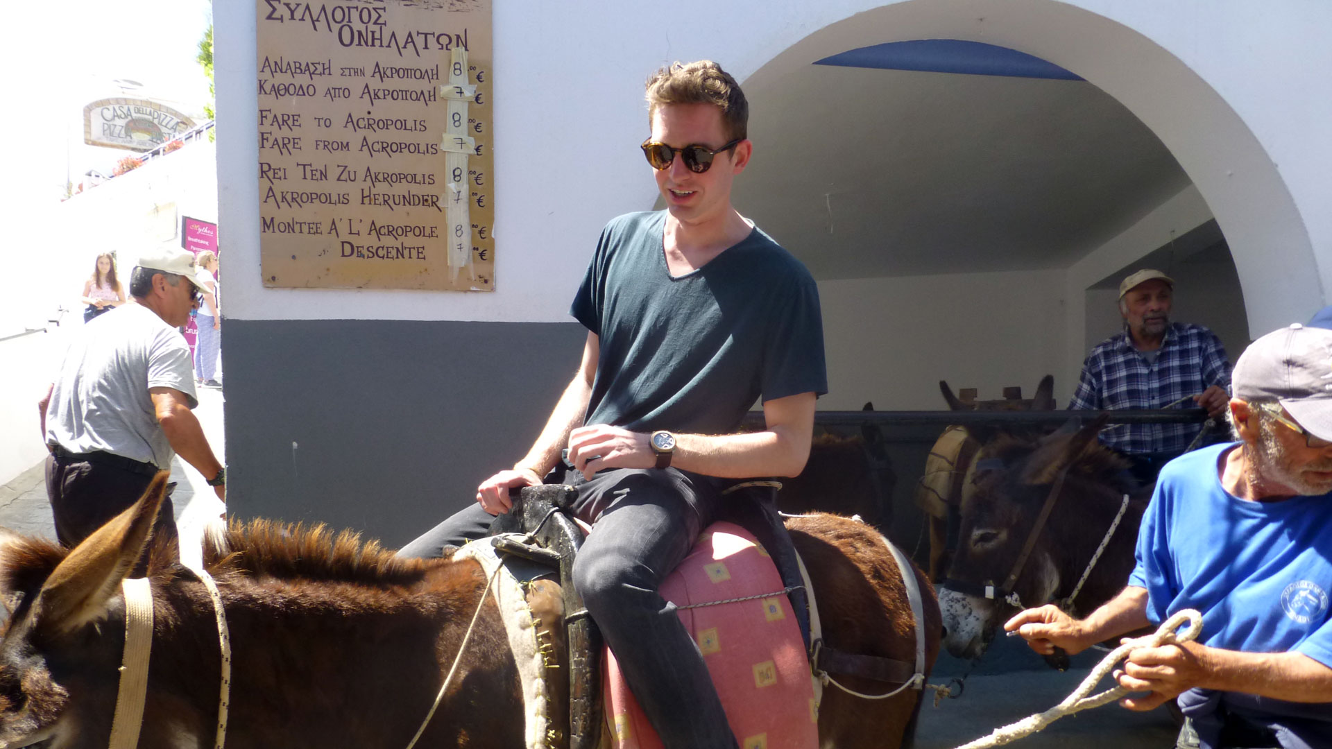 In Lindos, a village on the Island of Rhodes, students take a donkey ride to the Lindos Acropolis.