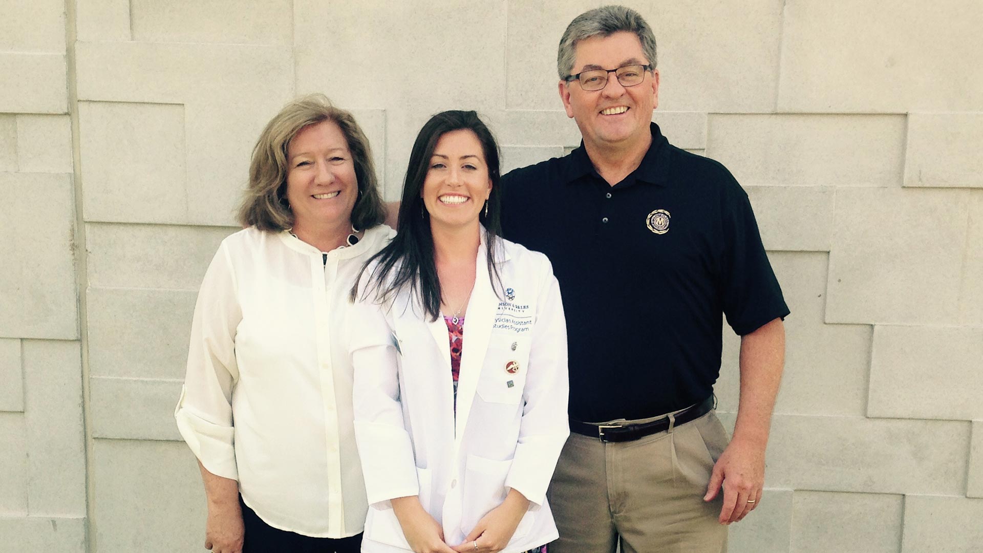 Heisler with parents at the White Coat Ceremony