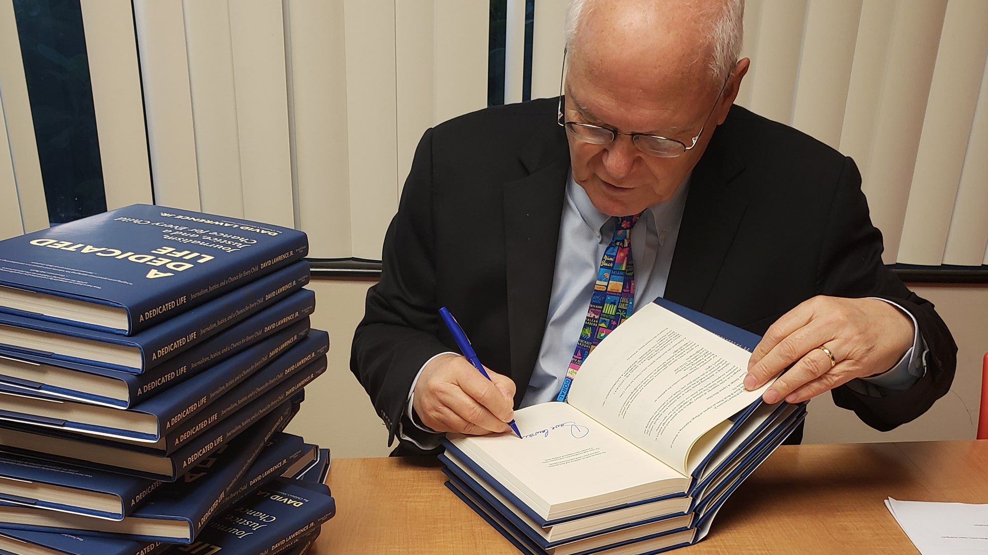 David Lawrence signing books.