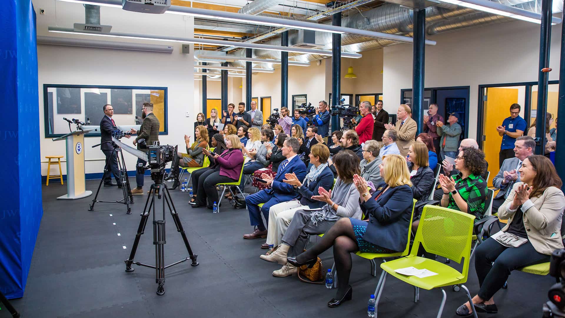 A crowd gathered to celebrate during the grand opening event.