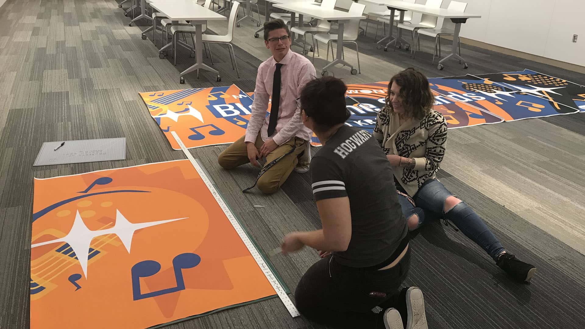 Students working on a banner for the concert.