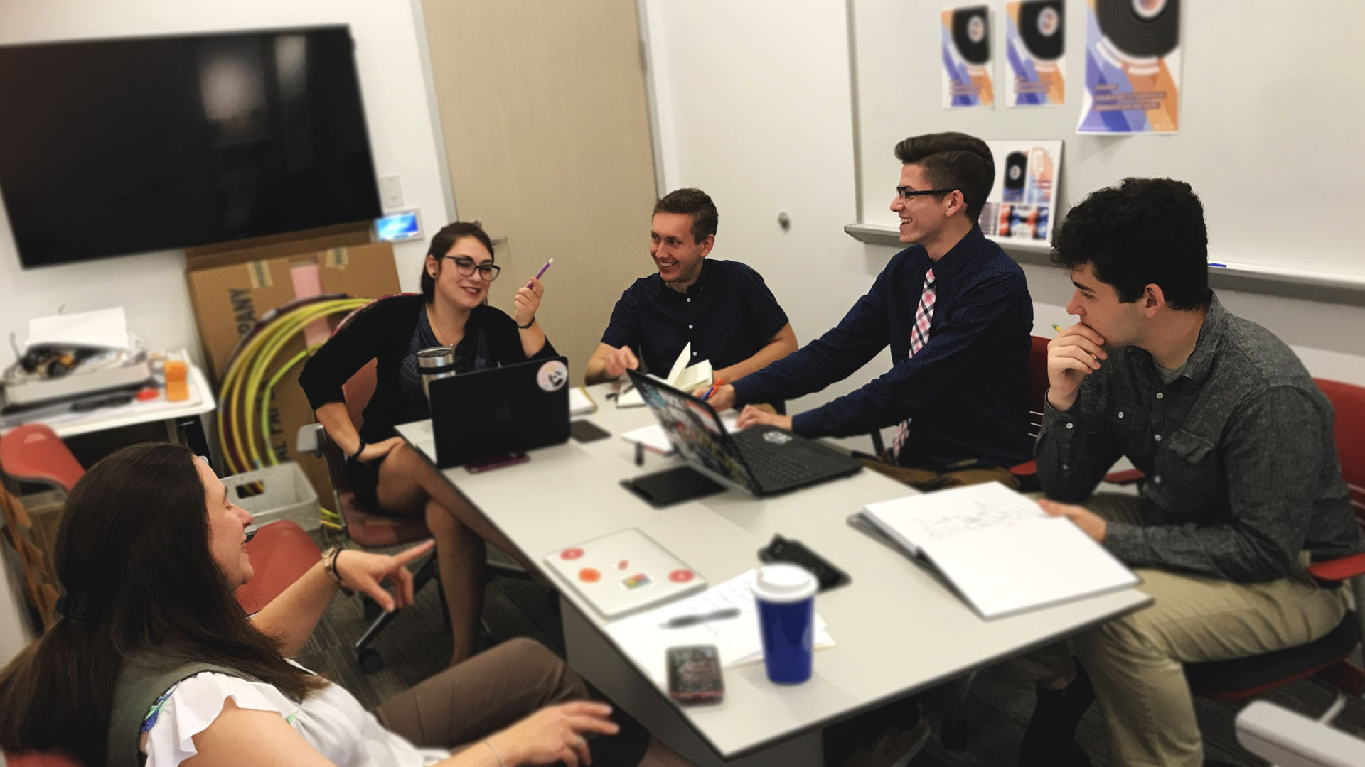 The team during a design consultation meeting with Assistant Professor Julie Viscardi-Smalley.