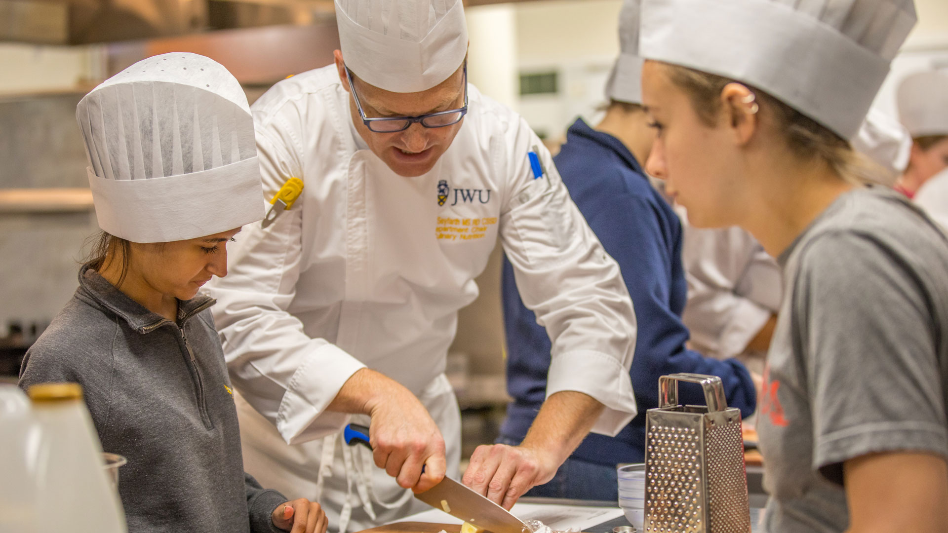 Occupational Therapy Doctorate (OTD) students work with Asso. Professor and Department Chair Todd Seyfarth to make healthy meals.