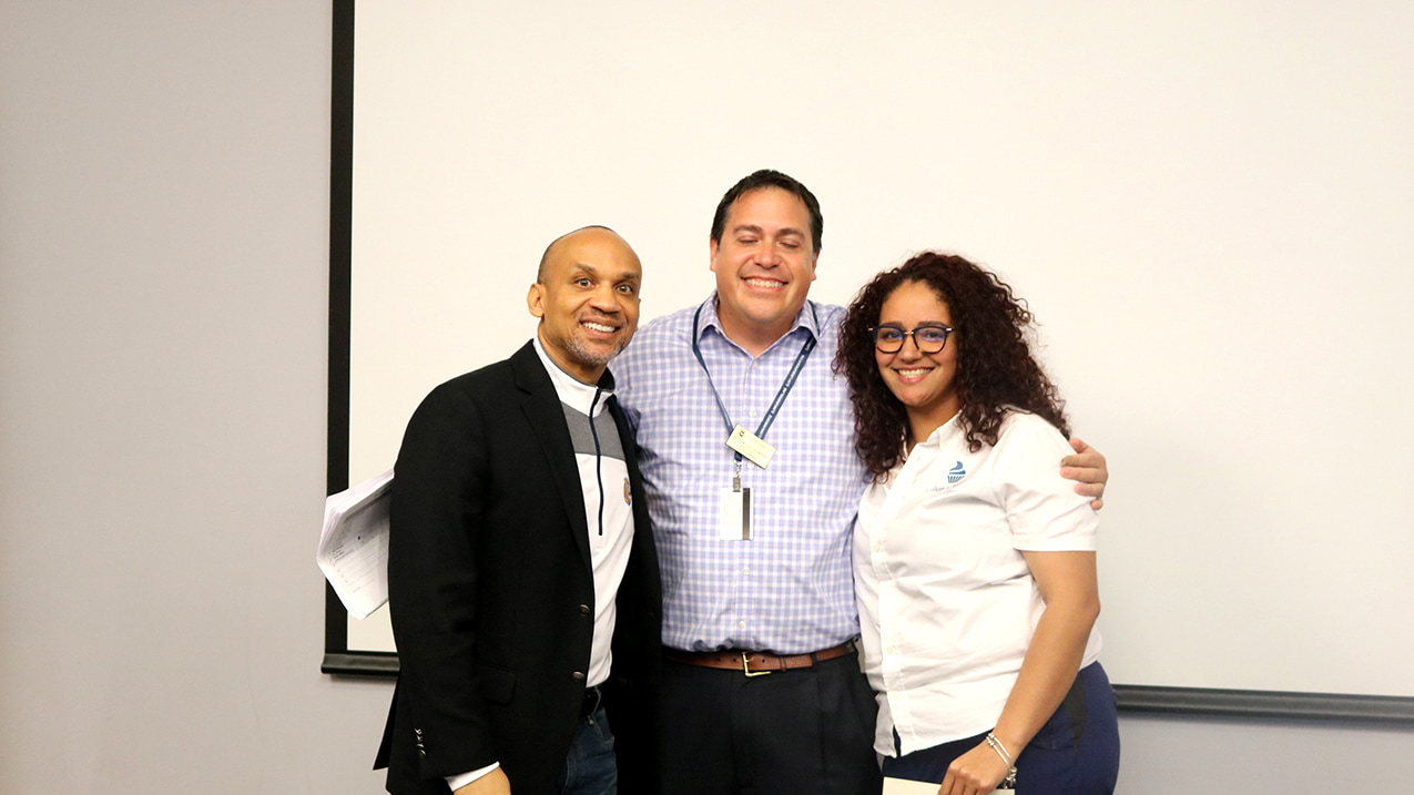 JWU North Miami President Larry Rice, Professor Brent Muckridge, and Sharkfest winner Angelique Davis