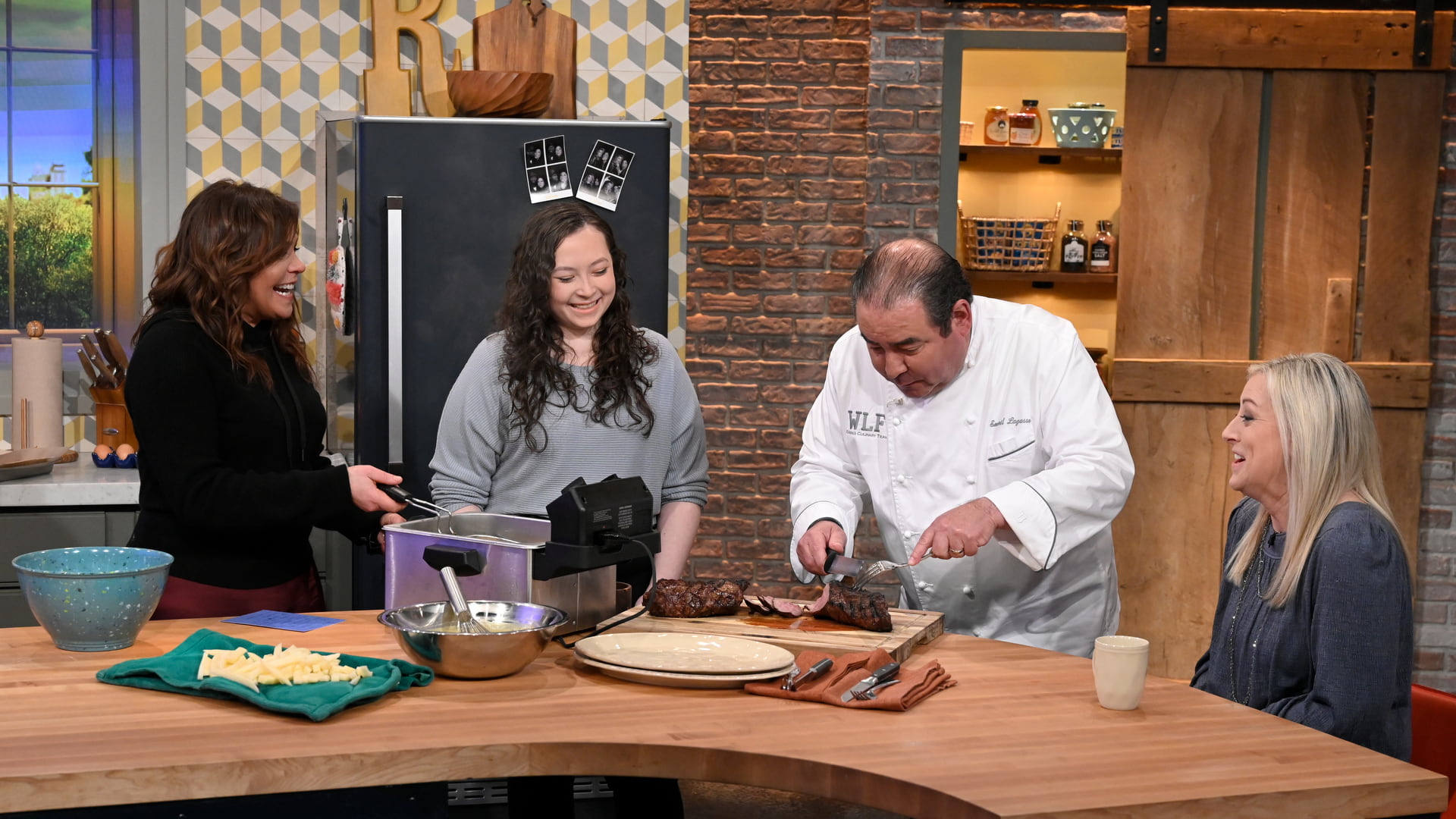 JWU student Alyssa Rosenthal cooking with Emeril on the Rachael Ray Show | Photo: David M. Russell/Rachael Ray Show