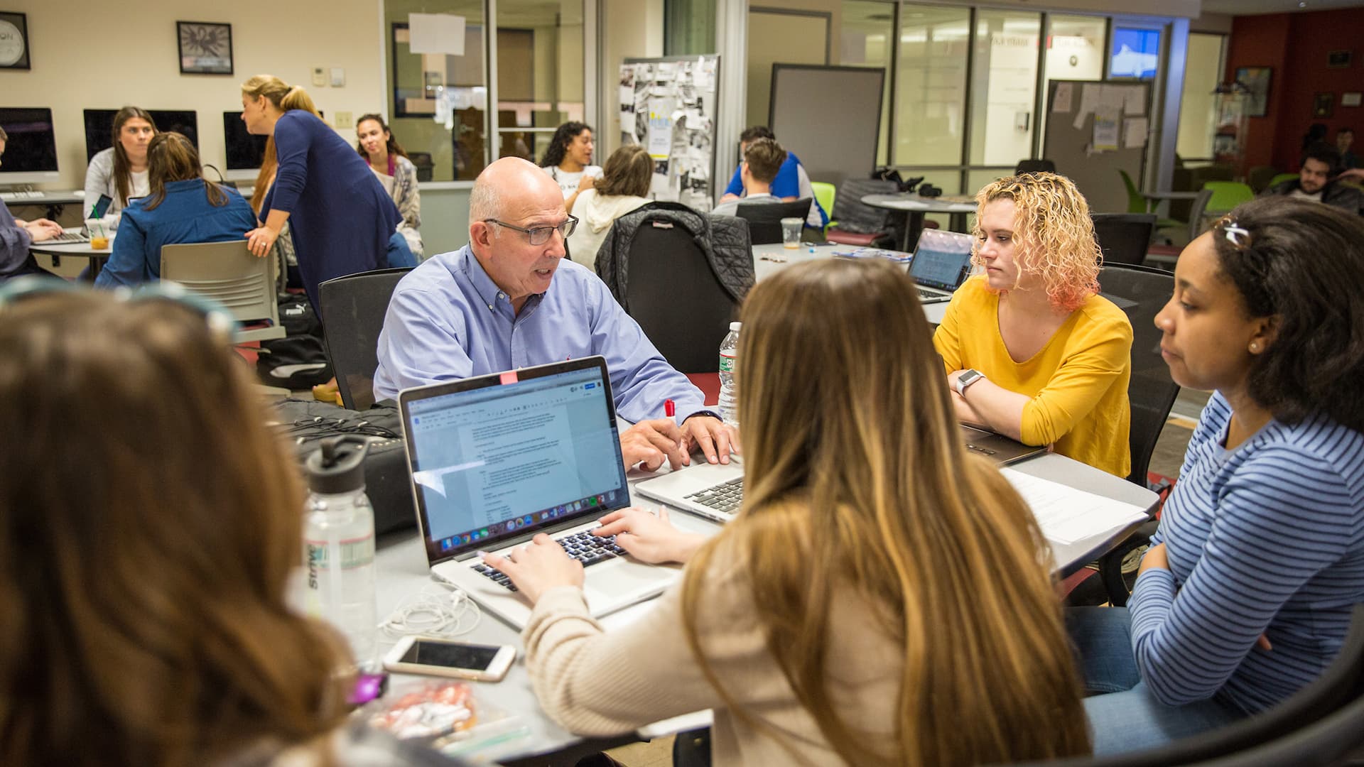 Professor Oscar Chilabato talks with students