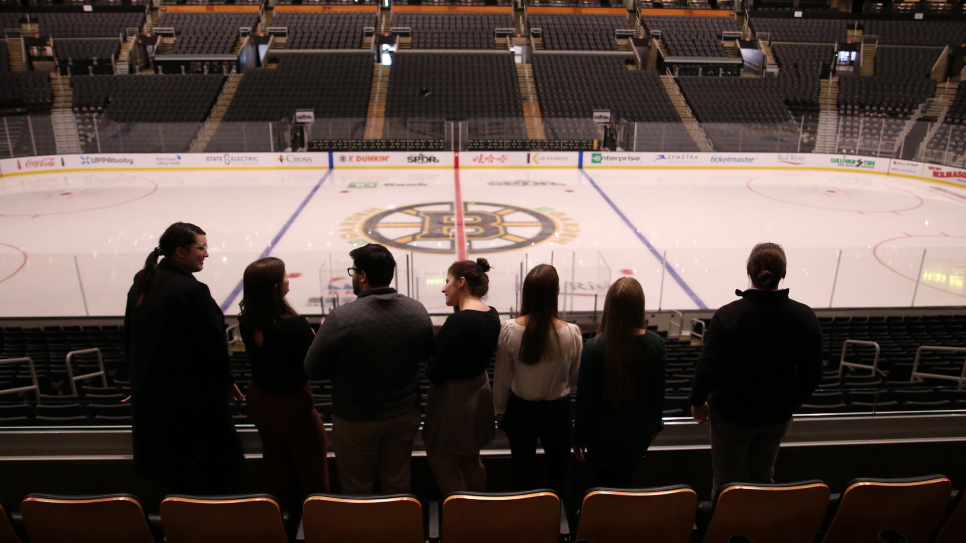 A group of JWU students overlook the Boston Bruins' rink at TD Garden in Boston