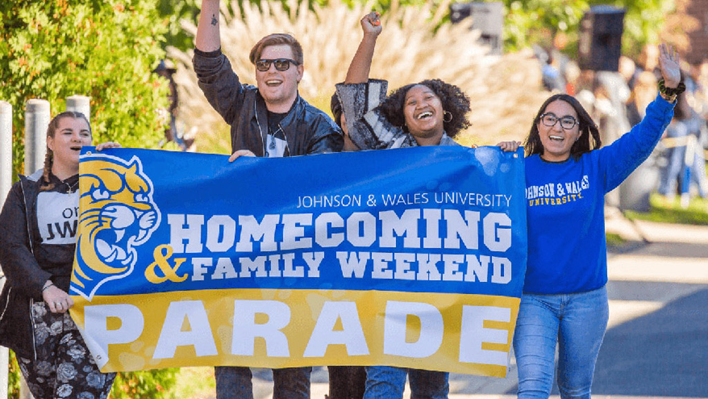 Students marching during the Homecoming & Family Weekend parade.