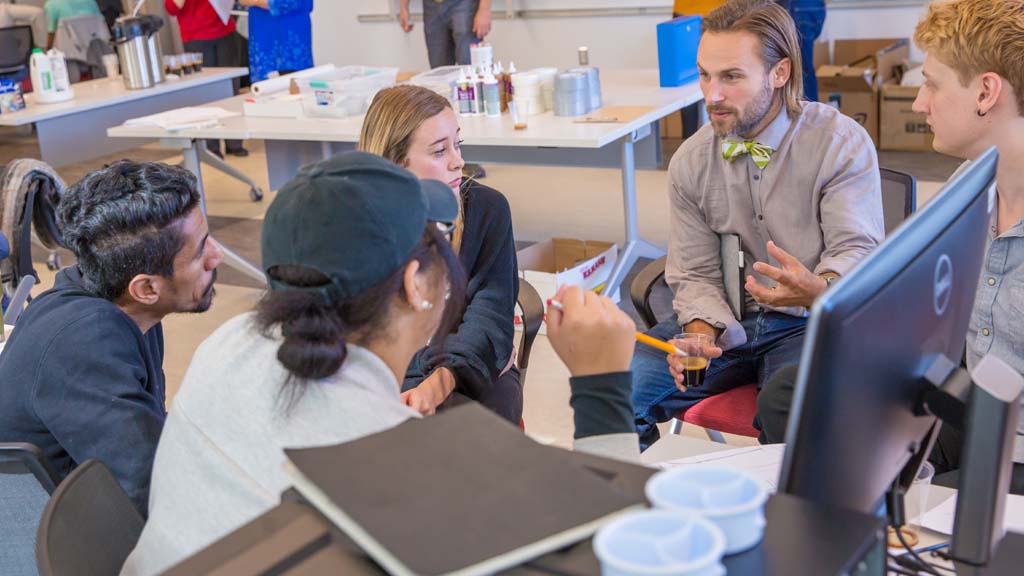 Associate Professor Walter Zesk during a classroom discussion with students.