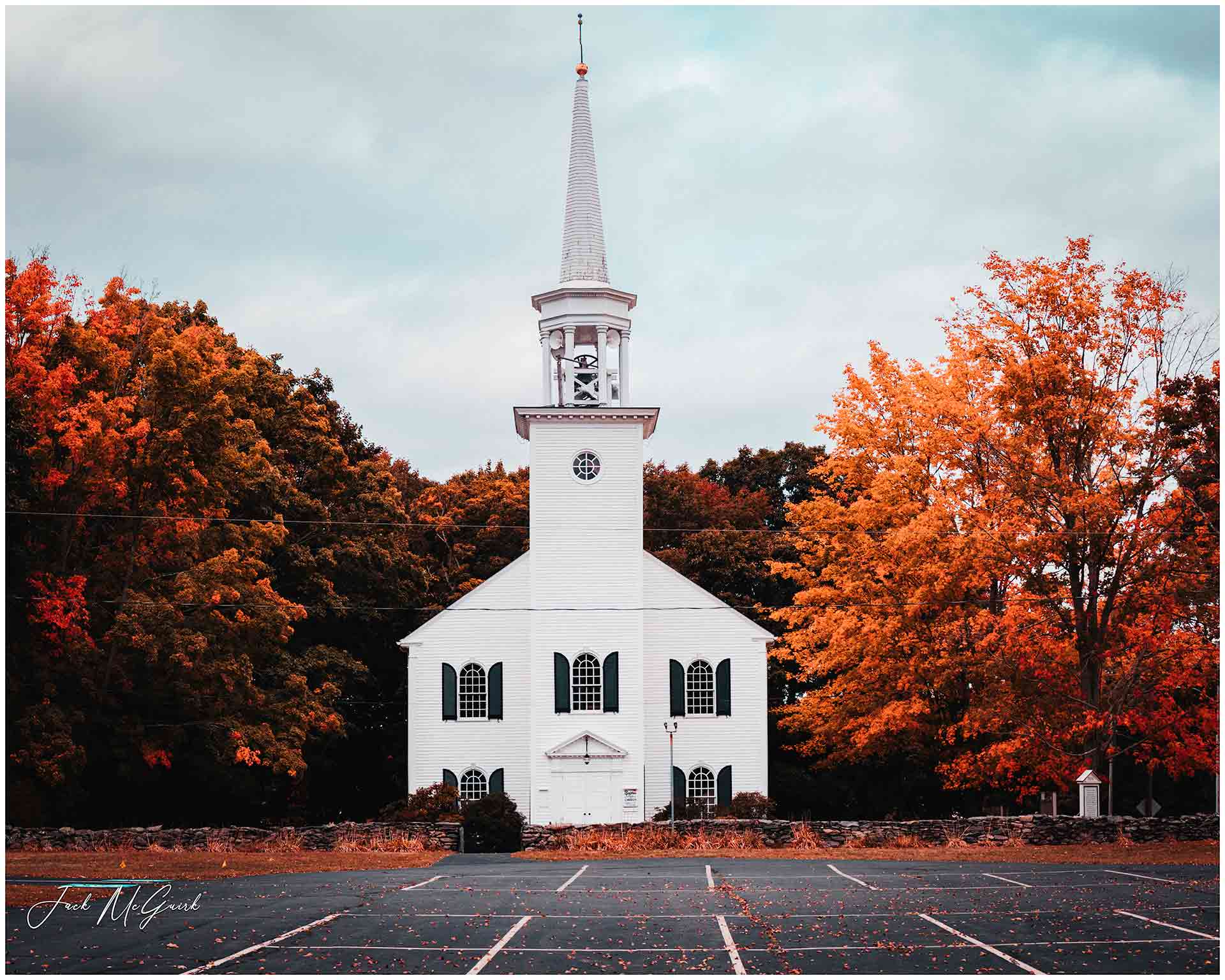 A photo of a church surrounded by autumn leaves by Jack McGuirk '21